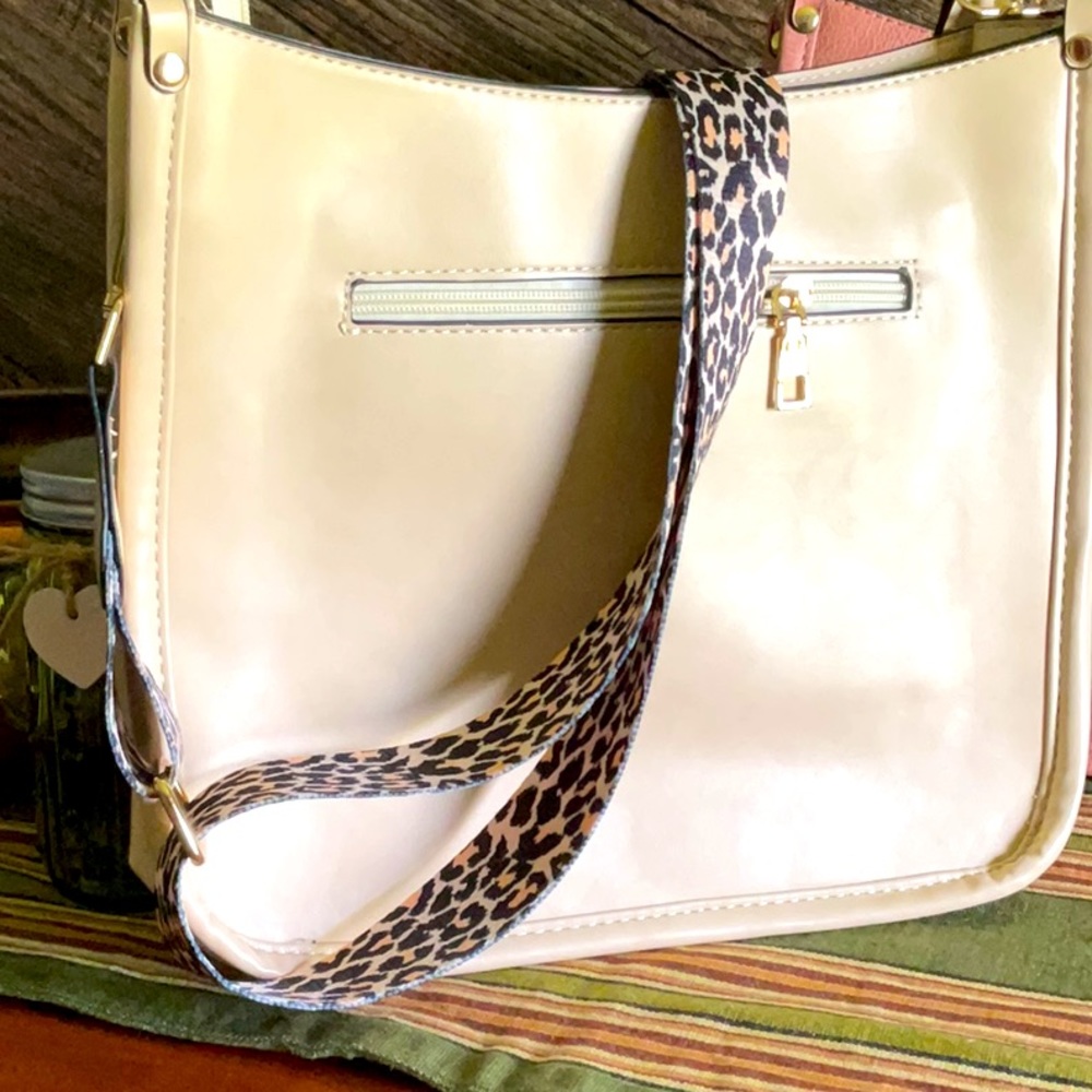 Leather purse with leopard print strap